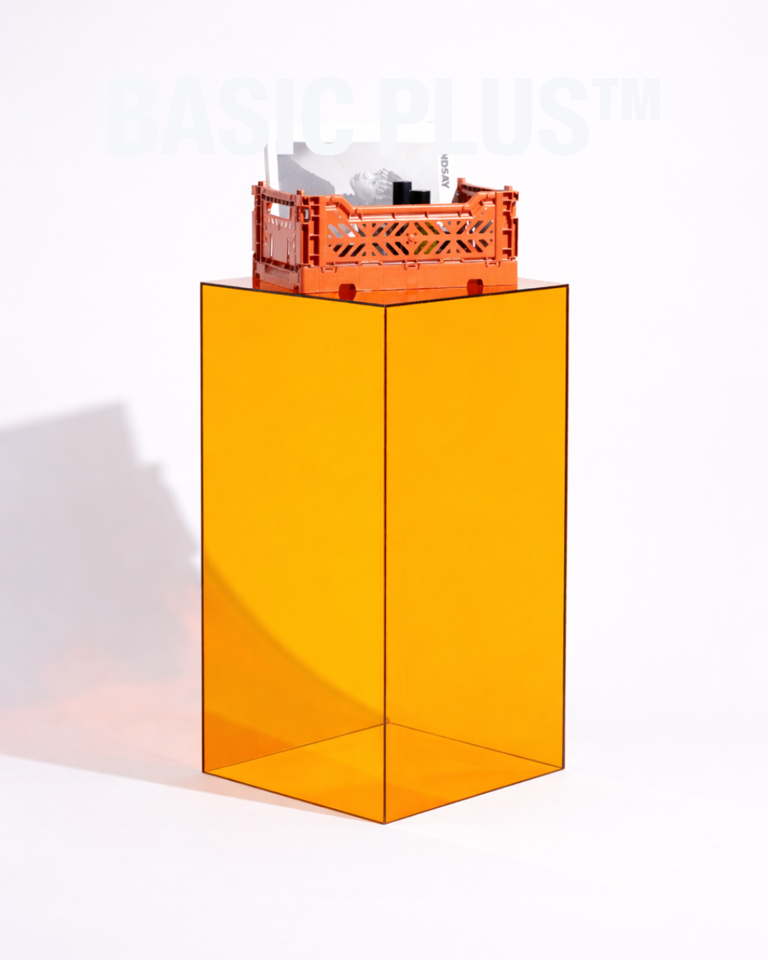 Transparent amber acrylic display plinth surface and edge detail