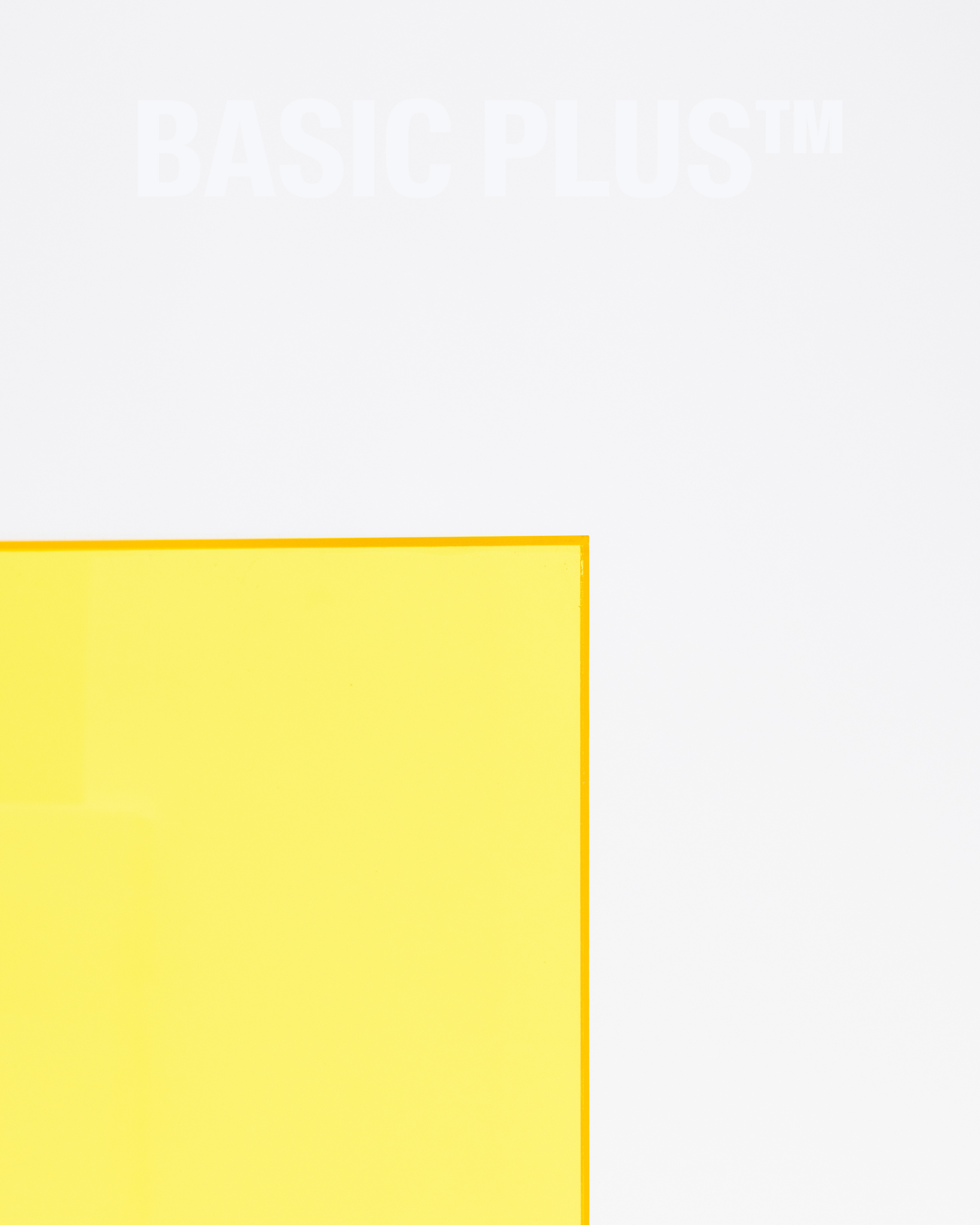 Transparent yellow acrylic display plinth surface and edge detail